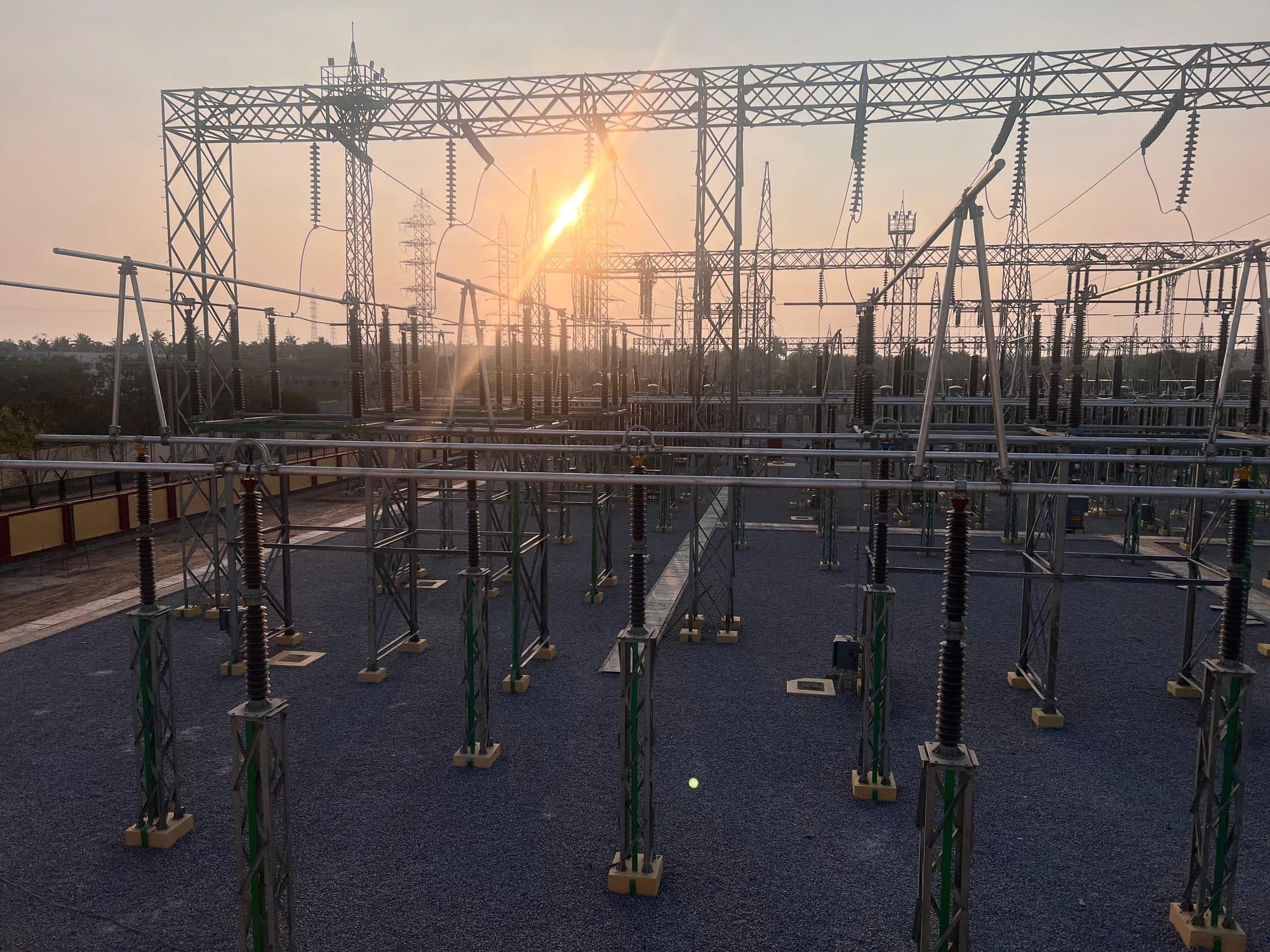 Gantries and bays with the sun flaring through the structures