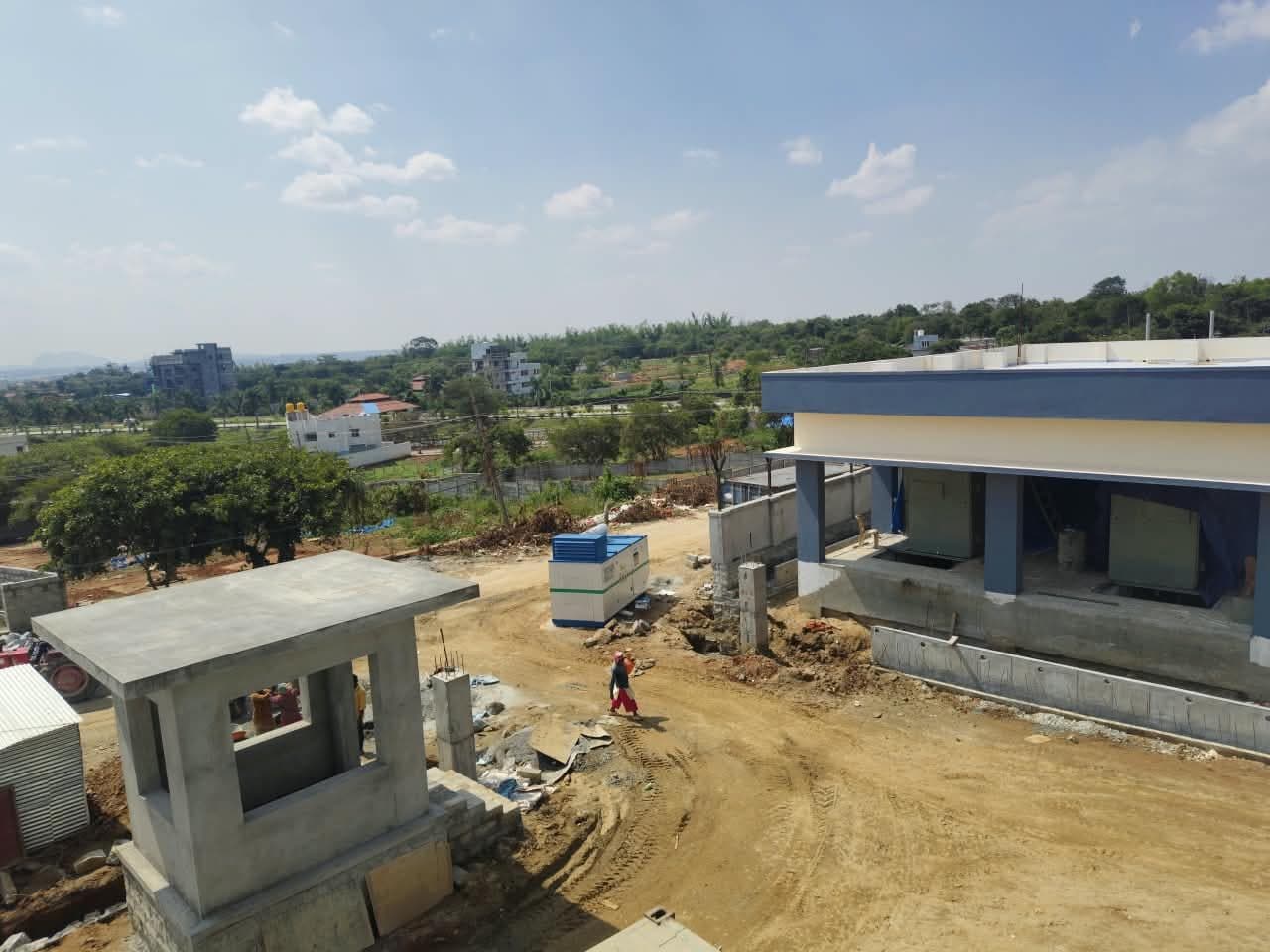 The station taking shape: the security cabin, and the control building going up behind it