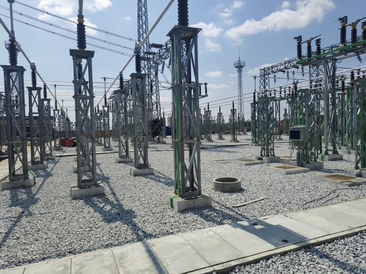 Isolator and current-transformer structures across the gravelled yard
