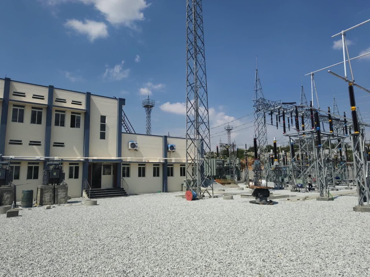 The control building beside the switchyard and a terminal tower