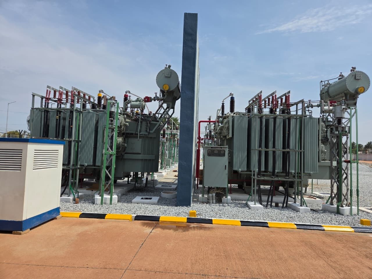 Two power transformers either side of a firewall, the fire-protection cabinet in front
