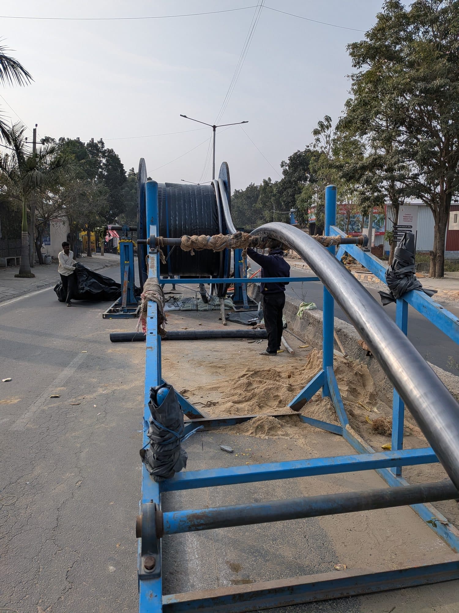 Cable drawn off its drum at the roadside