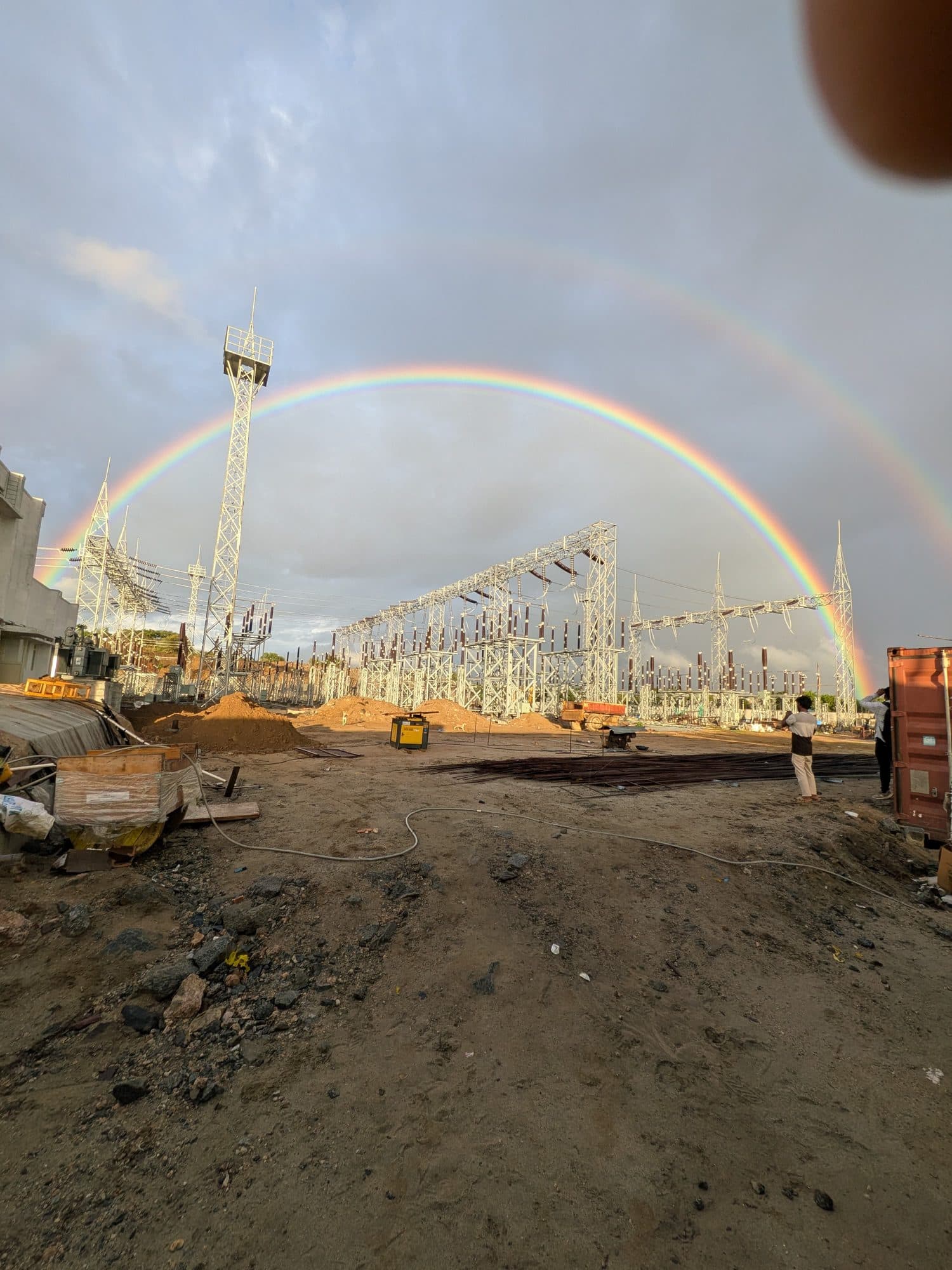 A rainbow over a sub-station site, the cable works in the foreground