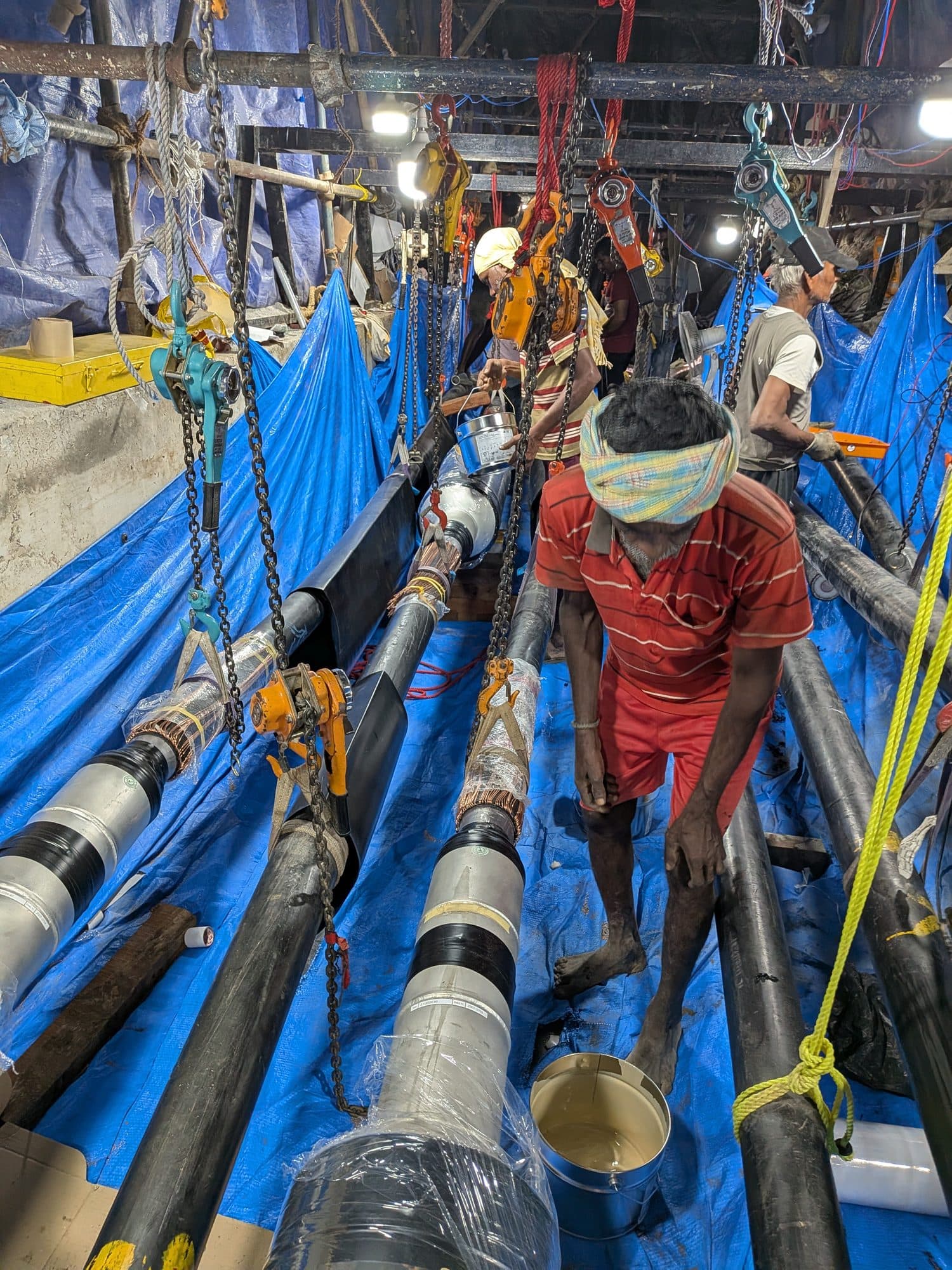 The crew working along the cables in the jointing pit