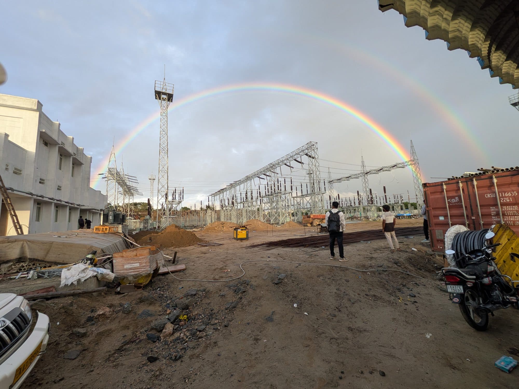 A rainbow over the site, the crew and machines below
