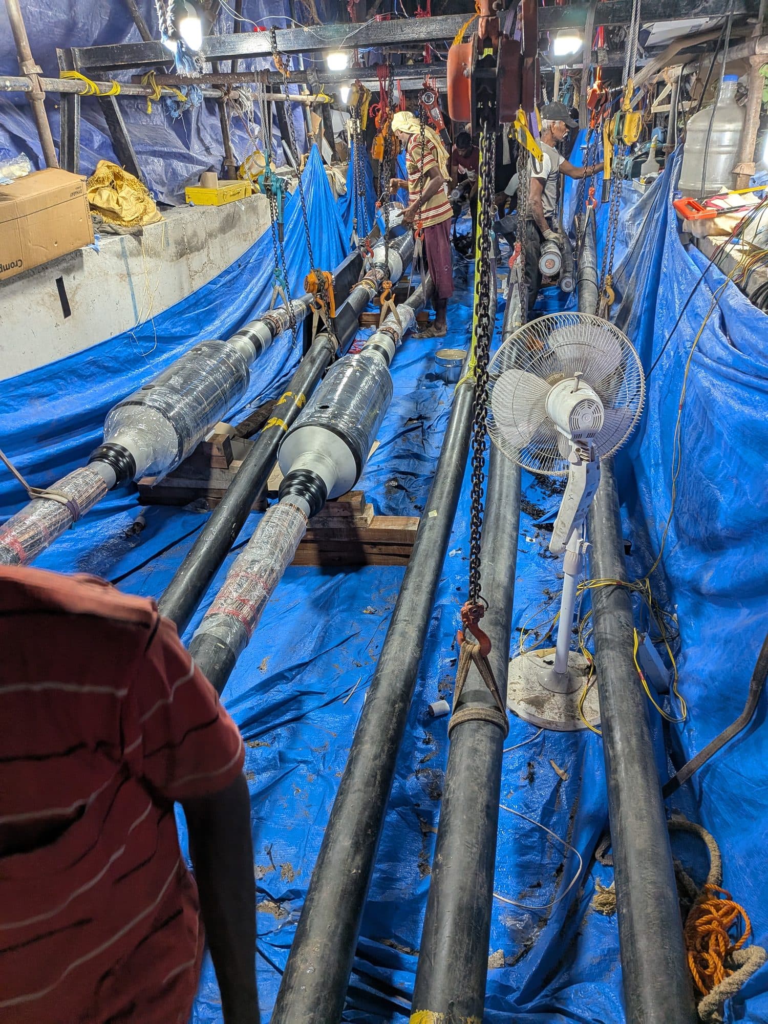 The jointing pit, cables on sheeting and the crew beside them