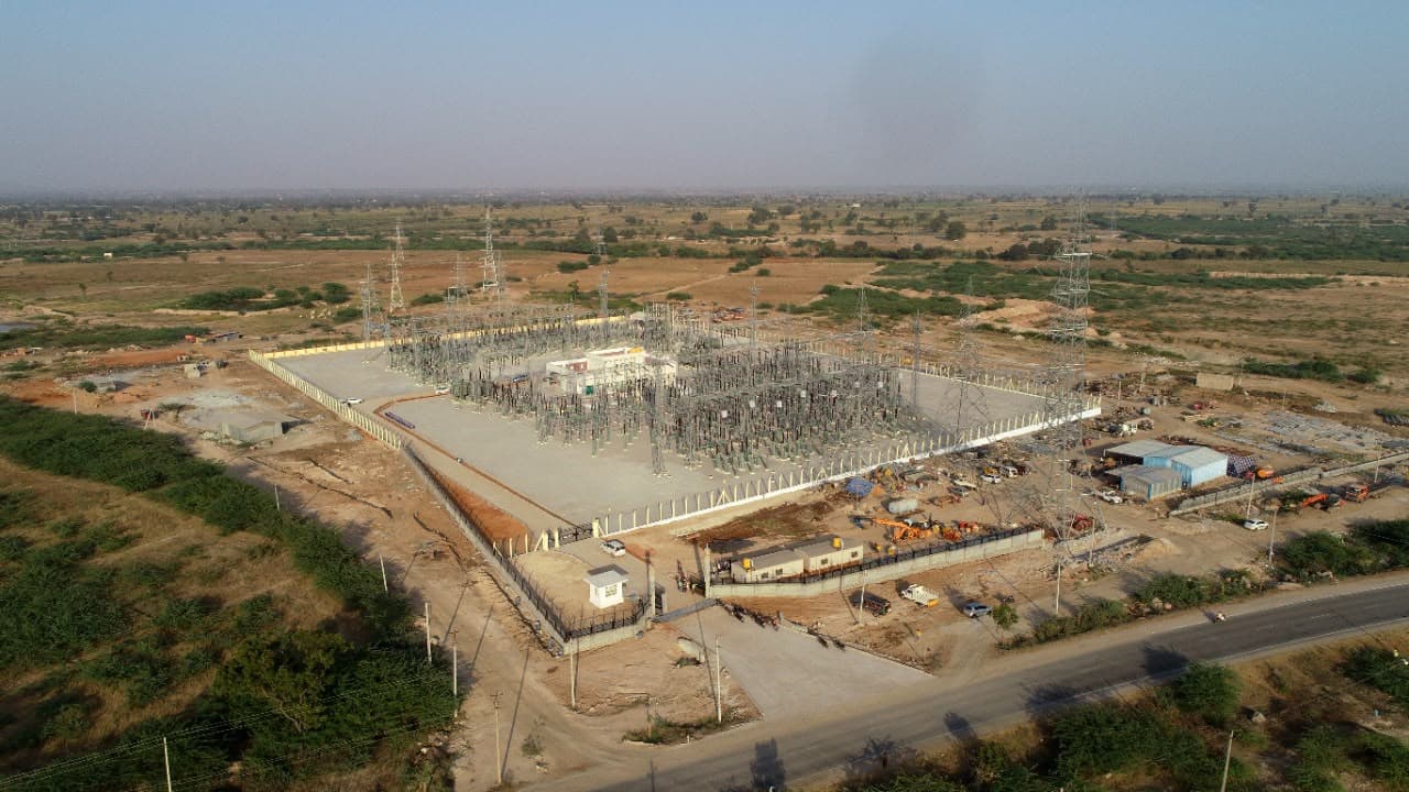 A sub-station beside a highway, from the air