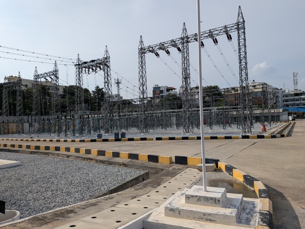 Gantries beyond the road and the flag-mast plinth