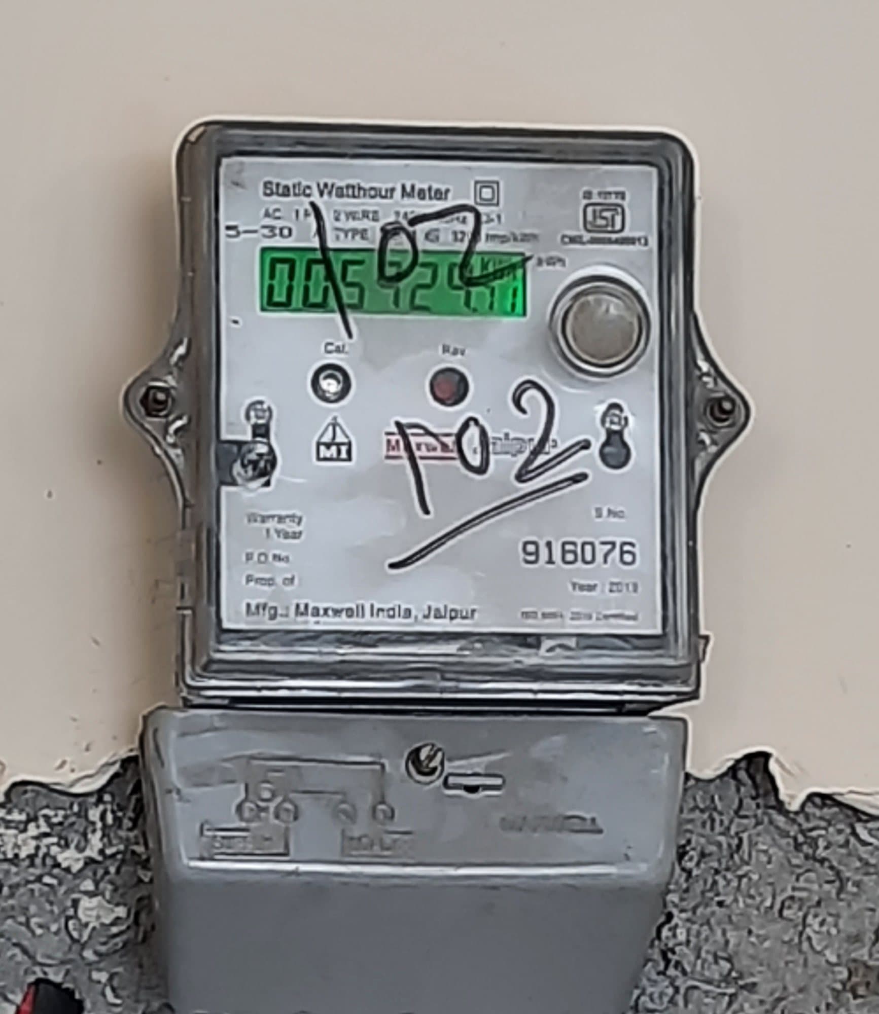 A household static watt-hour meter on a wall