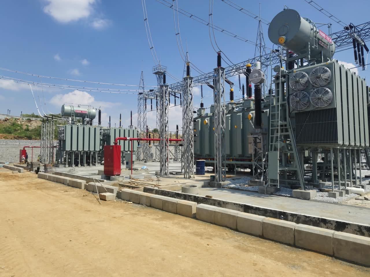 Power transformers in their bays as the yard is finished around them