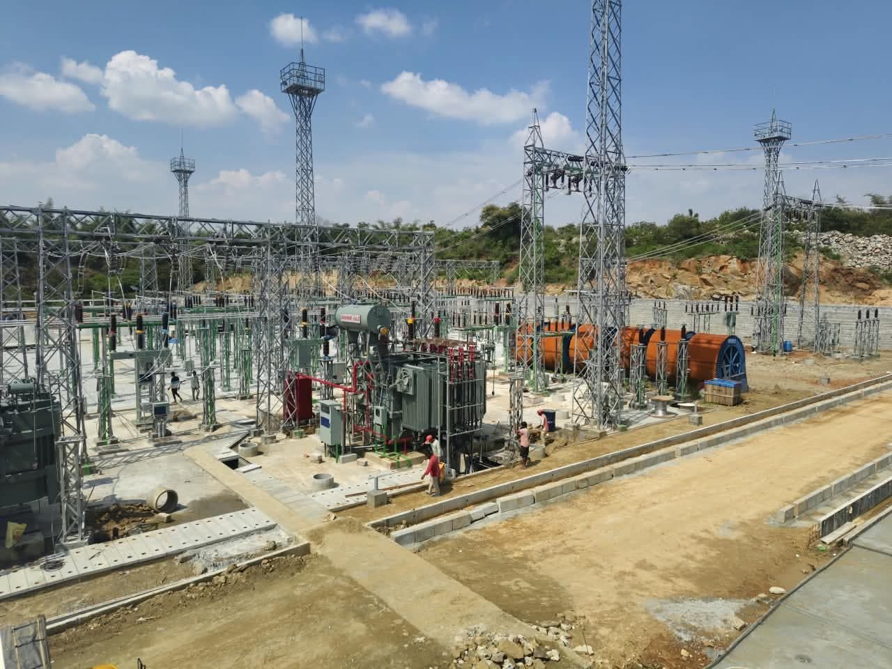 A transformer bay under erection, cable drums alongside