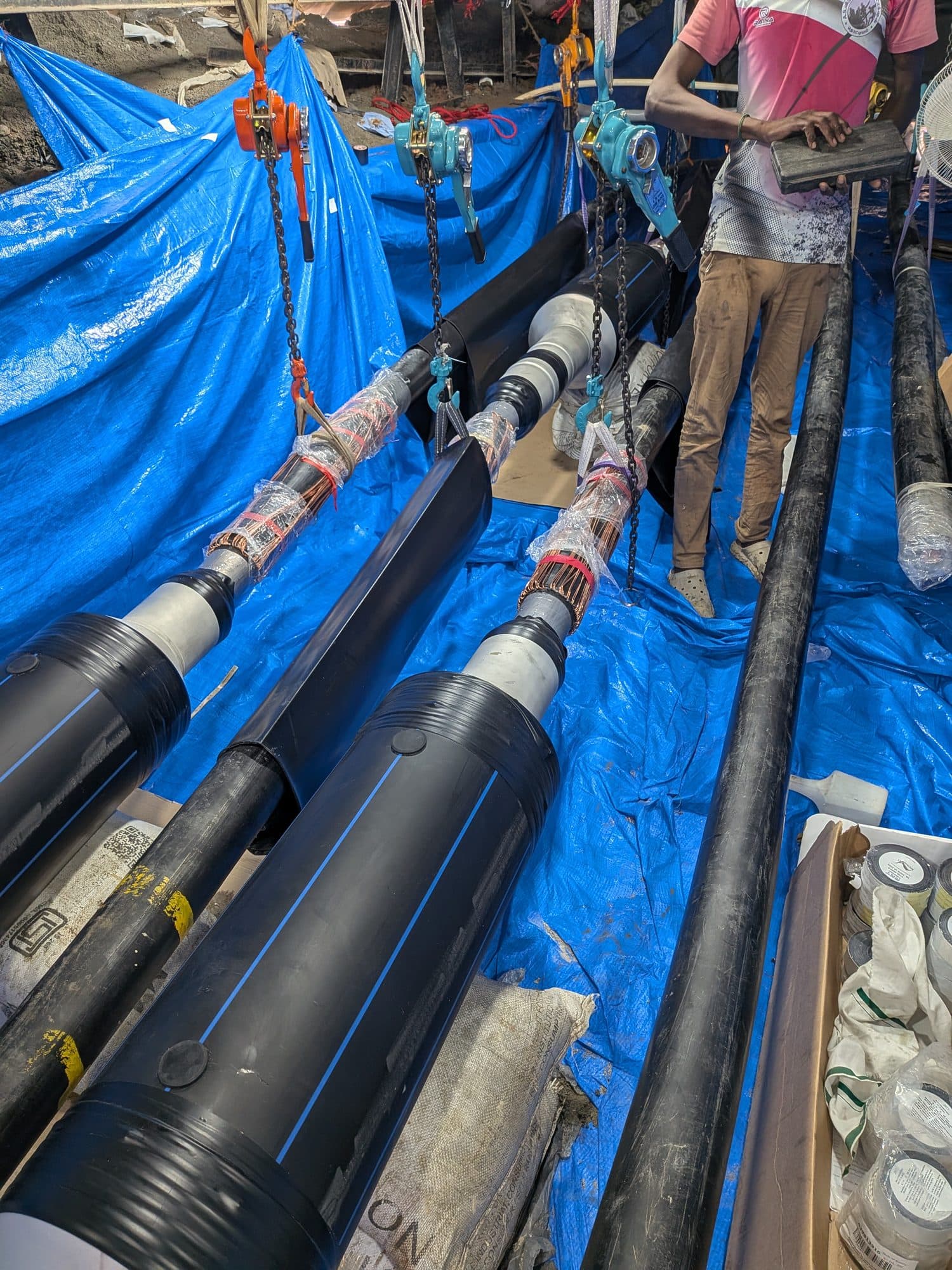 Cable joints laid out on sheeting in the jointing bay