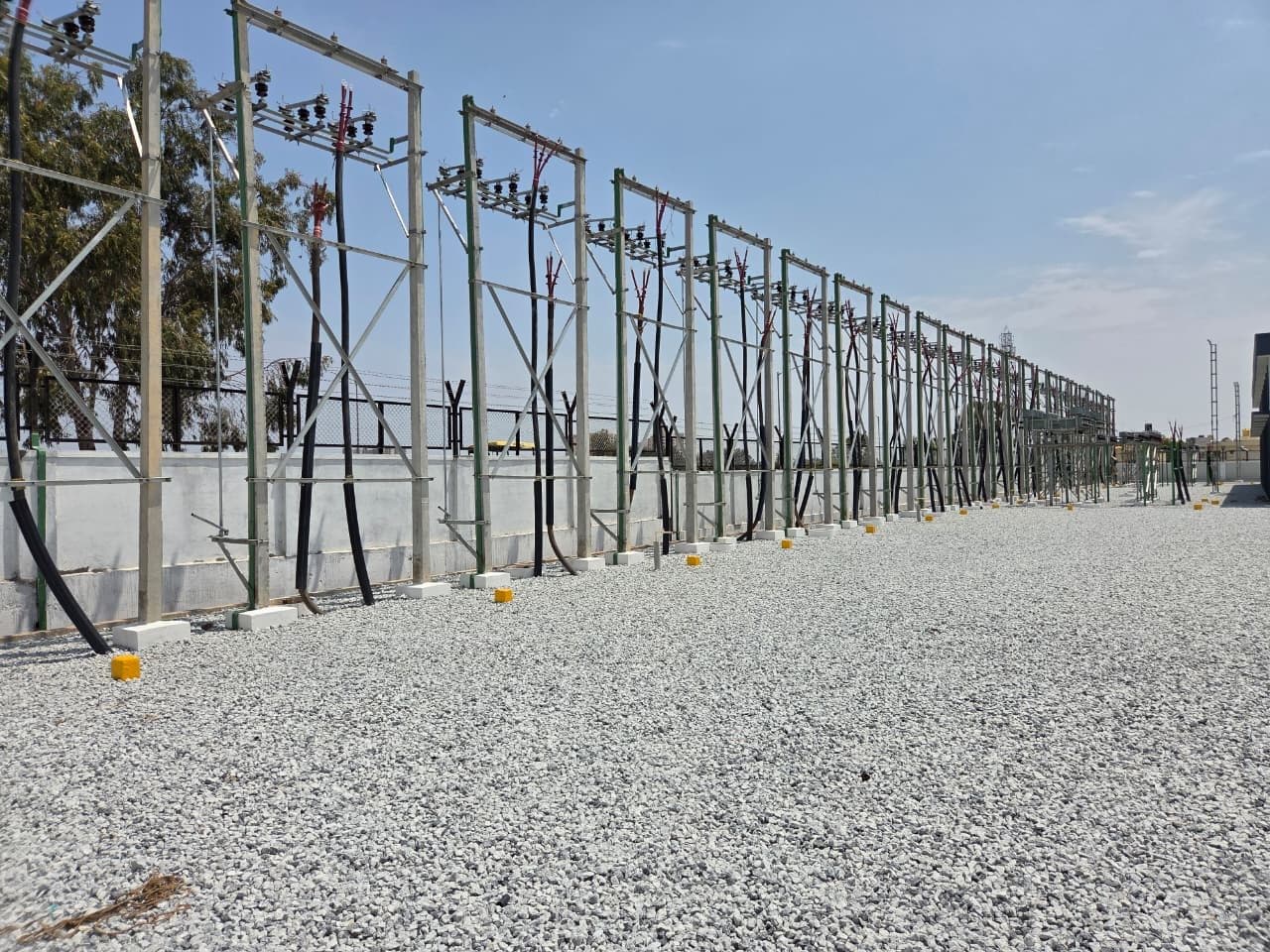 11 kV feeder structures along the compound wall