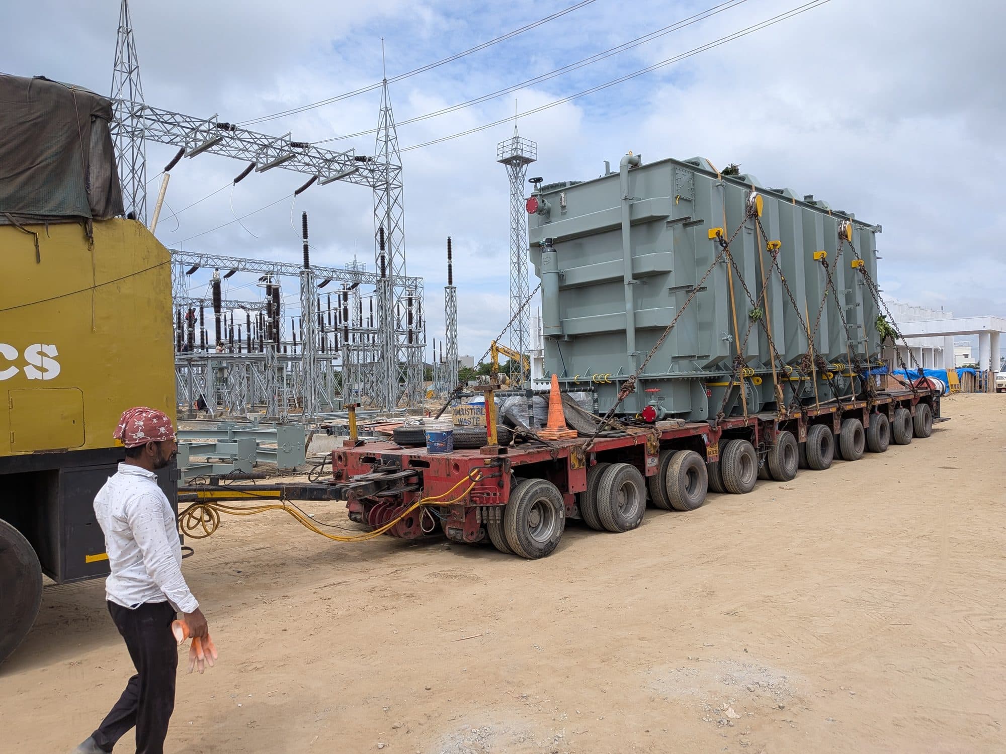 A power transformer on a multi-axle hydraulic trailer, arriving at a sub-station