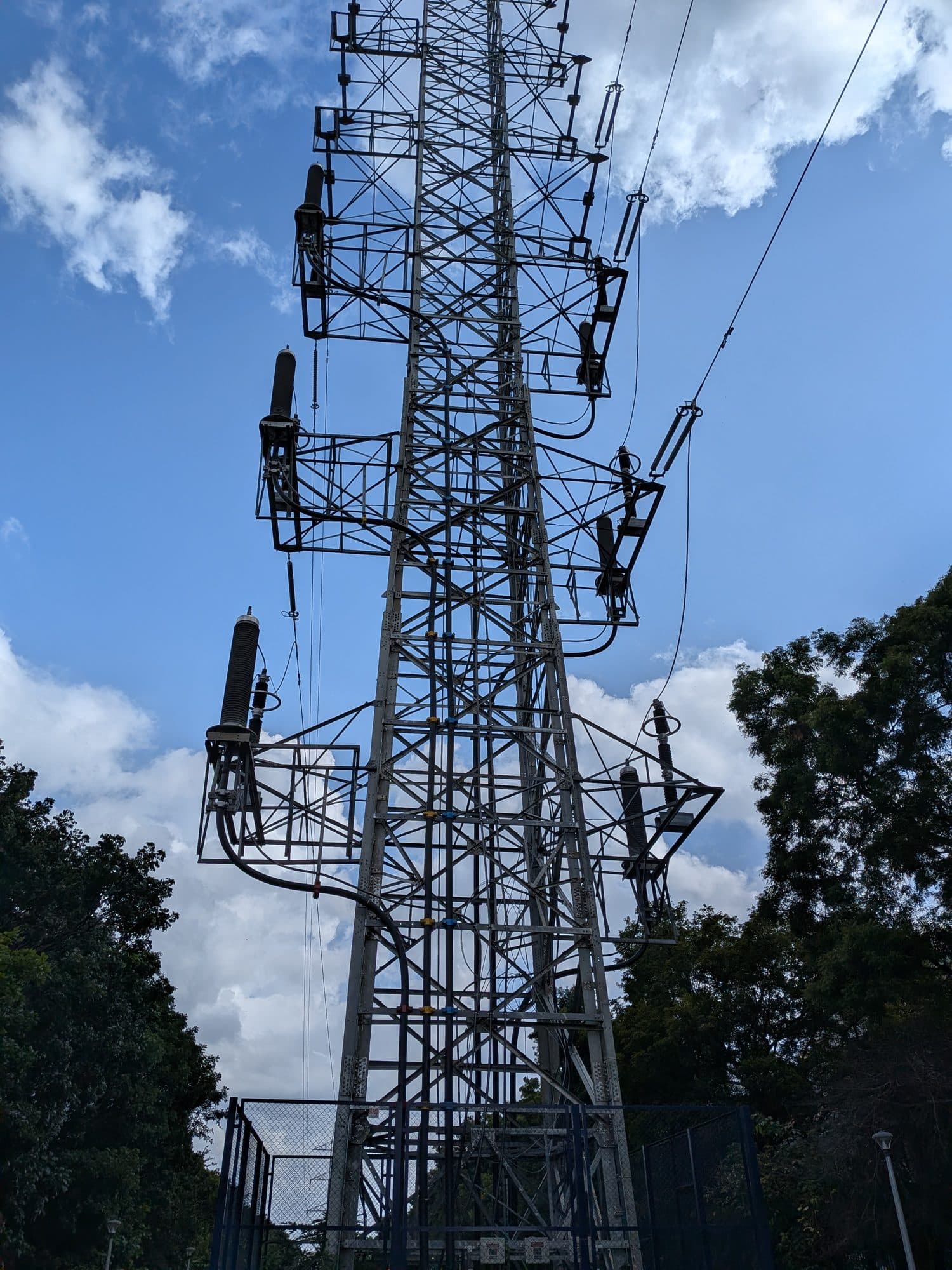 A transmission tower's cross-arms against the sky