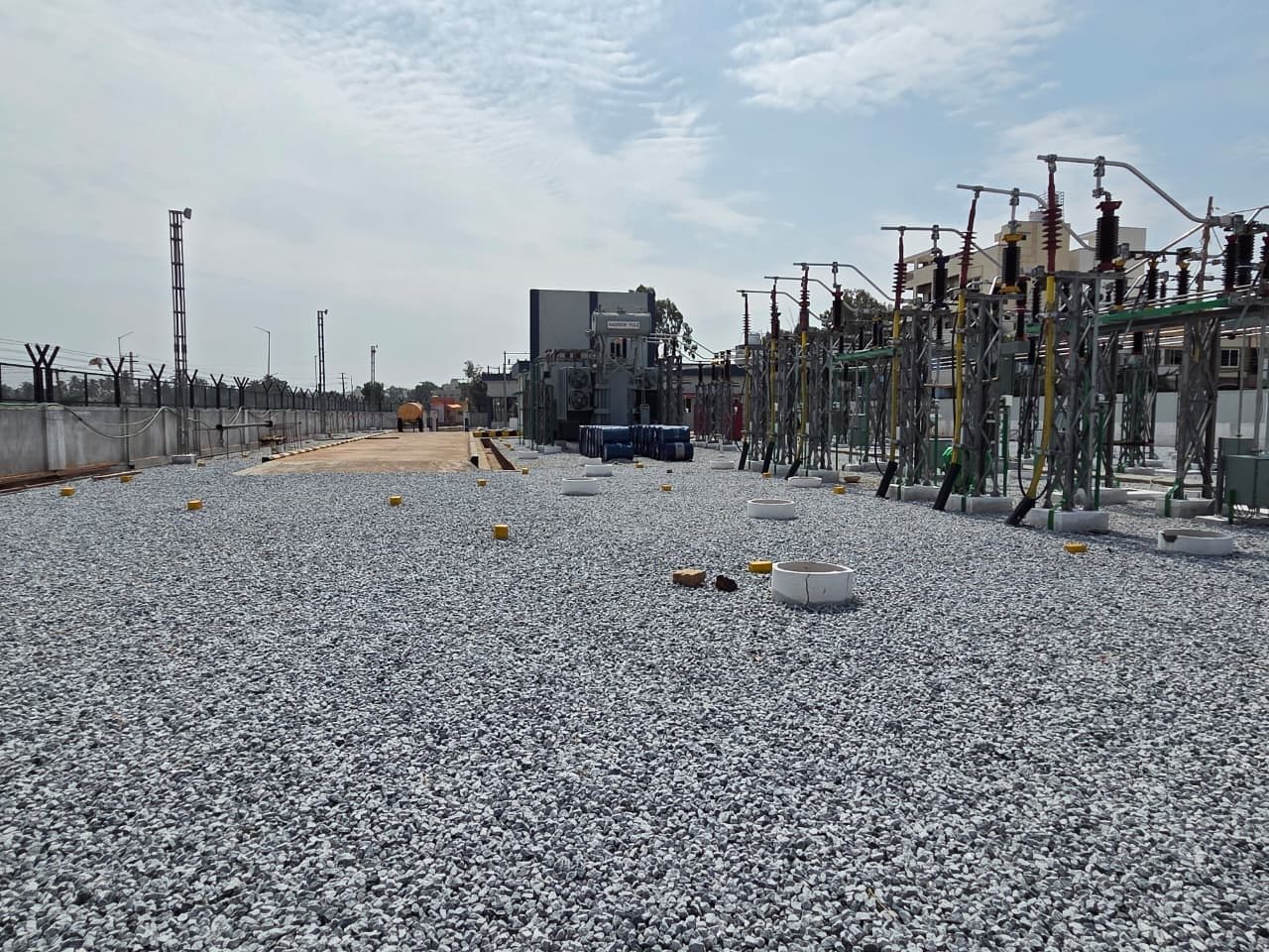 The yard, with the control building and its lighting mast